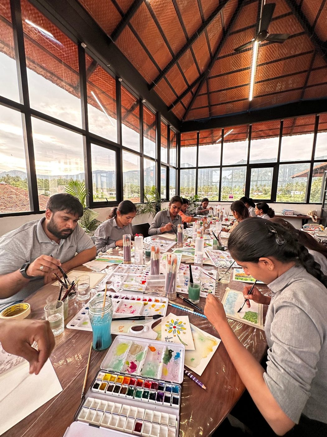 Therapists painting with watercolors in a class led by Mukta Balaji
